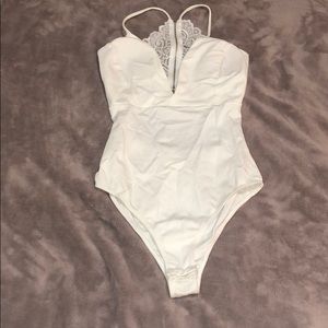 NWOT Lace back white bodysuit never worn
